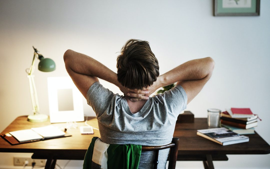 Man stressed while working on laptop