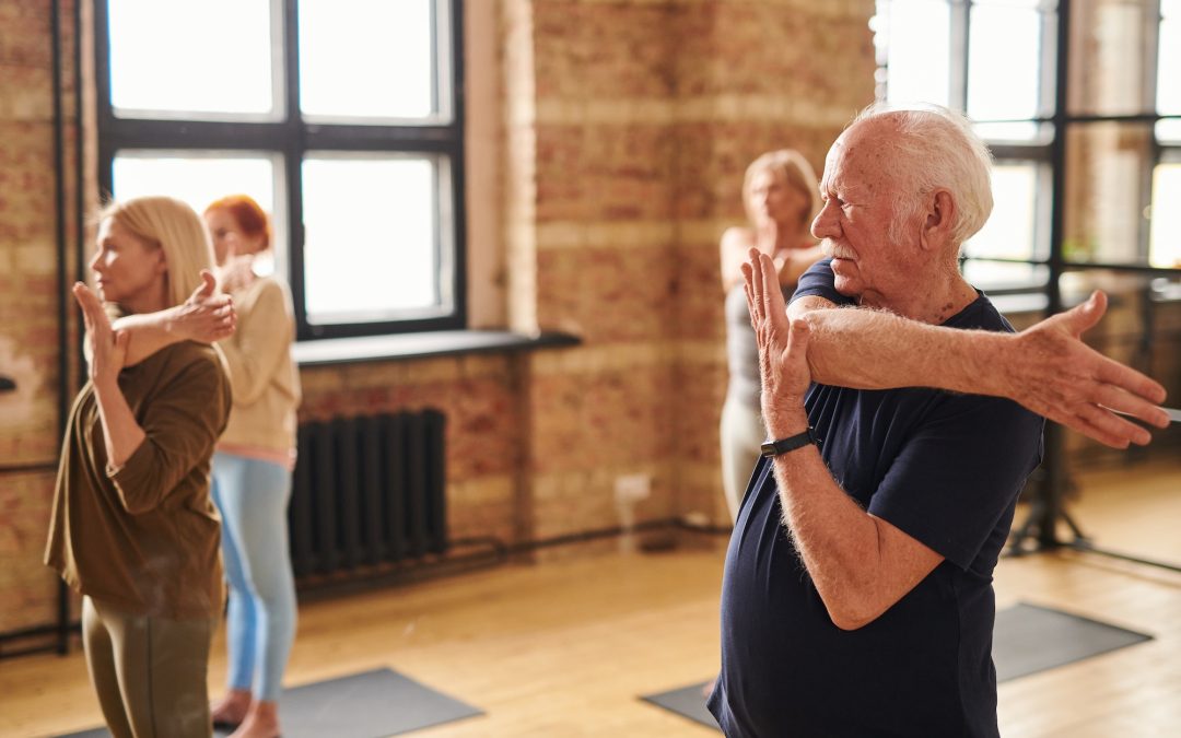 Senior people exercising in health club