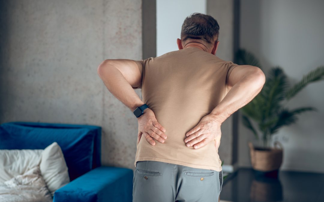 A man having pain in his lower back
