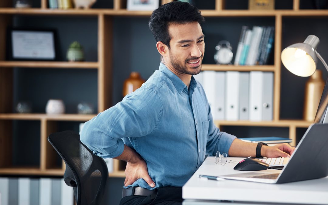 Back pain, man and stress at office desk of muscle injury, health risk and backache joint on chair.