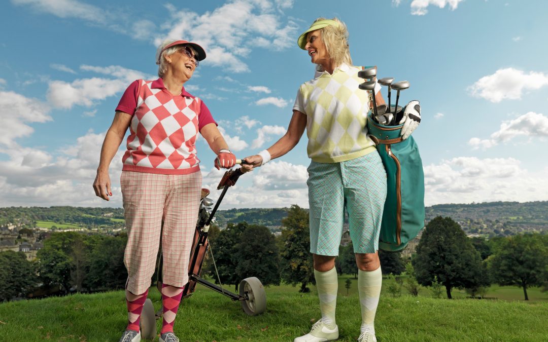 Mature ladies playing golf